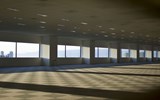 Empty carpeted office space with six windows